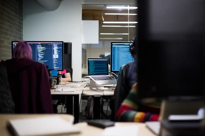 Developers collaborating in modern office workspace