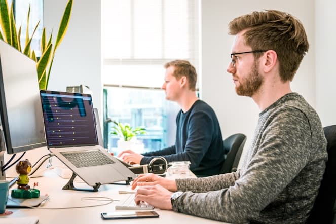 Senior engineer collaborating at desk